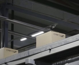 Automation - Cardboard boxes on conveyor belt in factory. Clip. Boxes moving on the conveyor at the factory.