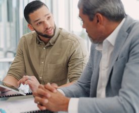 Business, men and tablet for conversation, brainstorming or fintech in modern office. Digital, Hisp.